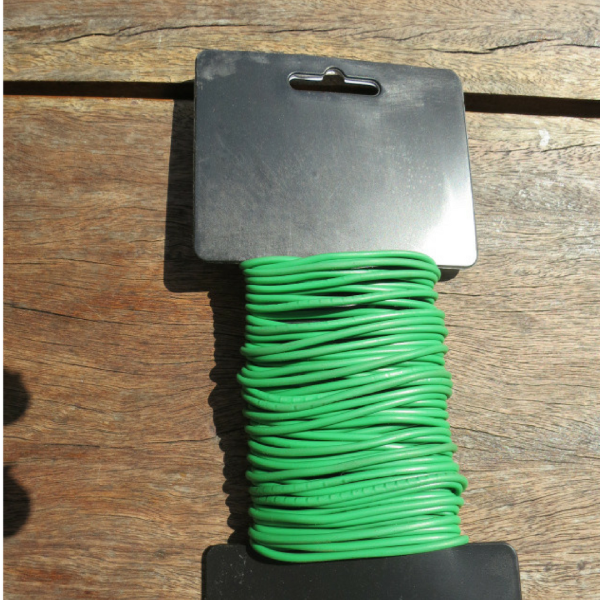 a roll of green flexible rubber garden tie wire